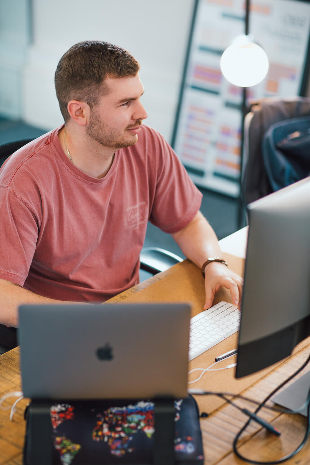 Photo of mmtm team member working at their desk