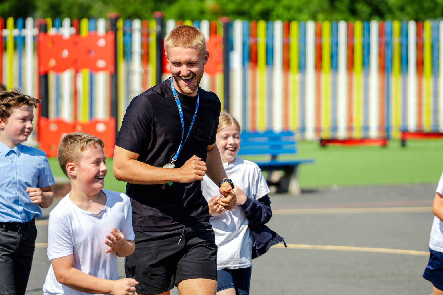 Kids running with teacher