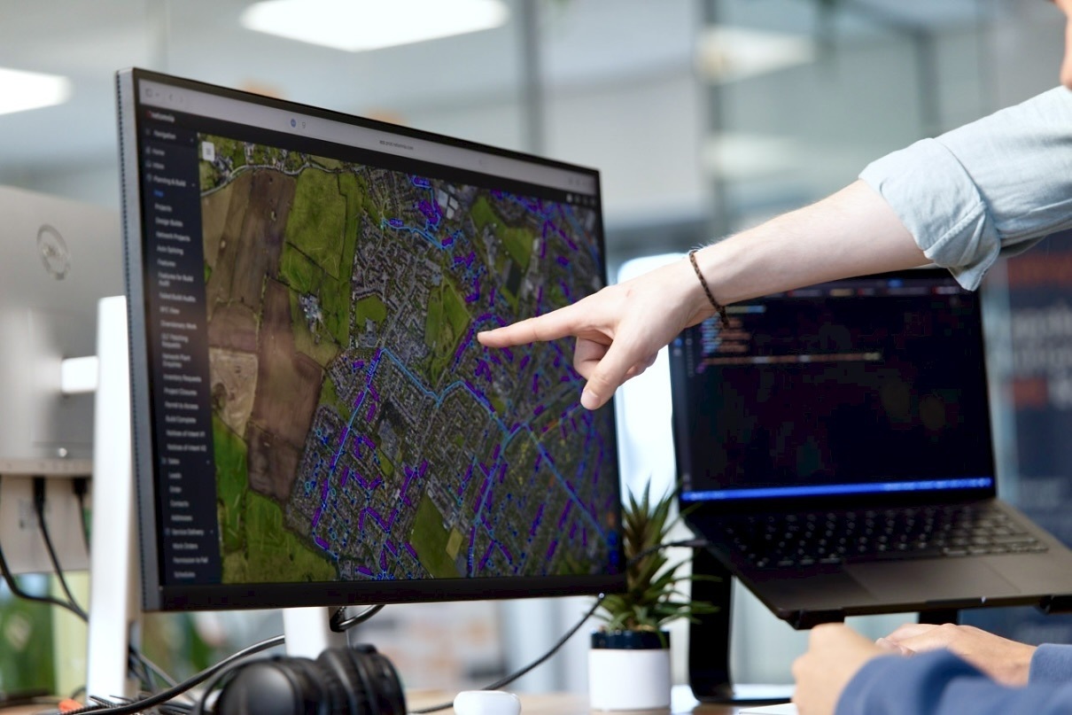 closeup of the ODIN map with a mmtm team member pointing at the screen