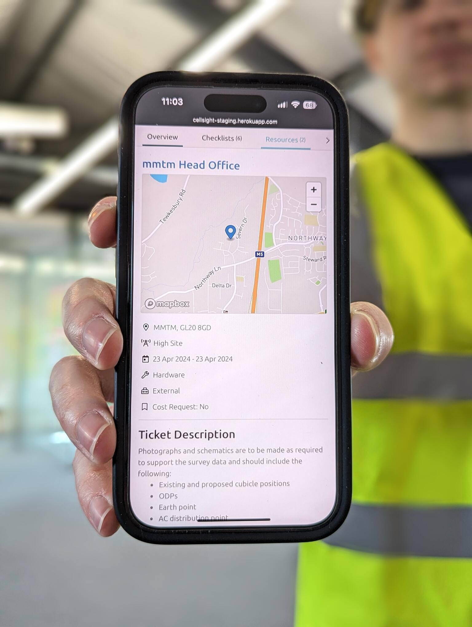 a phone with a mmtm-built operations app on the screen