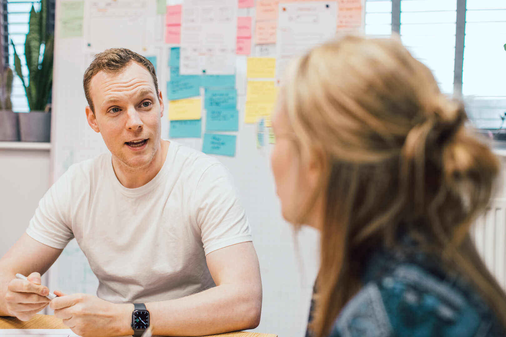 mmtm team collaborating at a workshop with sticky notes on the whiteboard